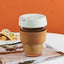 Silica Gel Glass Coffee Cup With Silica Strap Gripping Slanted Cap